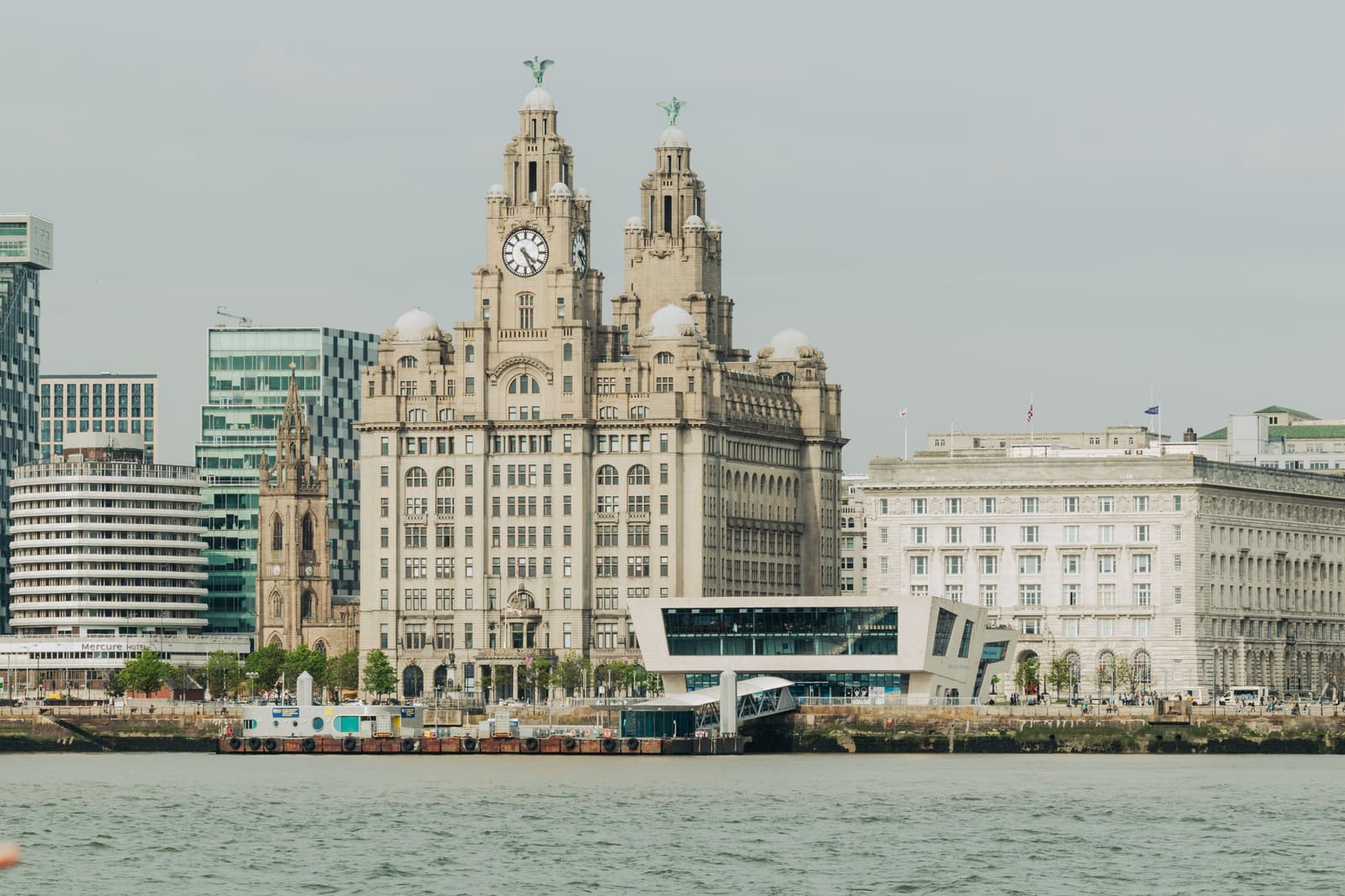 The Royal Liver Building and the Pier Head seen from the River Mersey on an overcast day